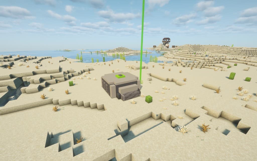 Green overworld bunker exterior with lime beacon beam in a desert