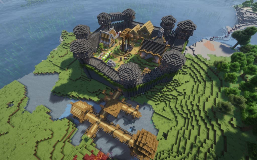 Safe zone fortress from above — walled town on a peninsula with a wooden bridge entrance